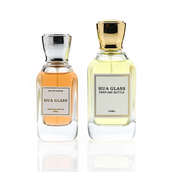 HUA0363 perfume bottle, flat rectangular clear glass body with centered paper label, elegant trophy-shaped plastic cap in gold or silver finish, royal classic luxury fragrance packaging design available in 50ml and 100ml