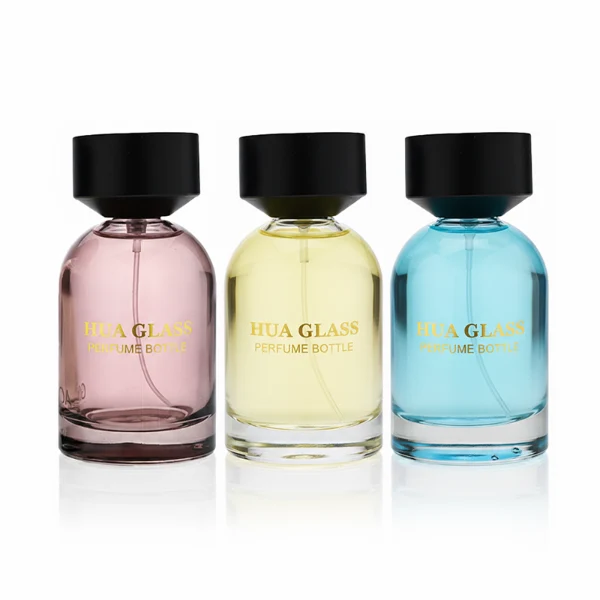 HUA0364 perfume bottle, round cylindrical glass body in translucent grey, red, and blue with gold printed logo, matte black inverted cone plastic cap, contemporary minimalist luxury fragrance packaging design available in 50ml and 100ml