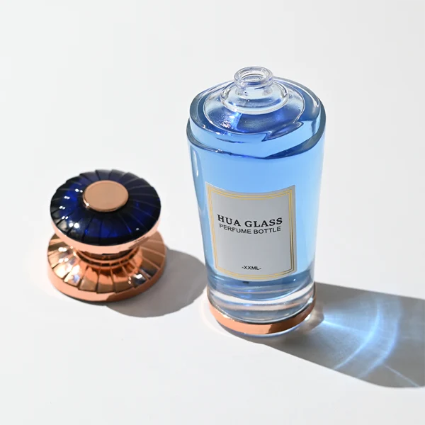 HUA0371 perfume bottle, inverted tapered glass body in translucent green or blue with centered paper label, ribbed umbrella-shaped plastic cap in mint green with silver or shiny black with rose gold wave shoulder accents, avant-garde luxury fragrance packaging design available in 50ml and 100ml