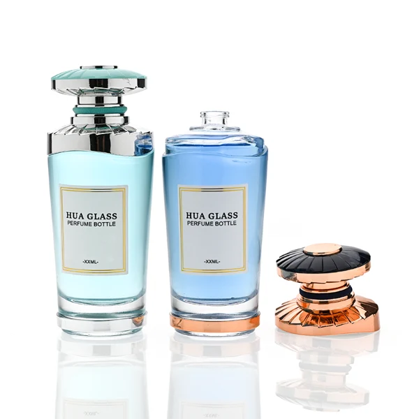HUA0371 perfume bottle, inverted tapered glass body in translucent green or blue with centered paper label, ribbed umbrella-shaped plastic cap in mint green with silver or shiny black with rose gold wave shoulder accents, avant-garde luxury fragrance packaging design available in 50ml and 100ml