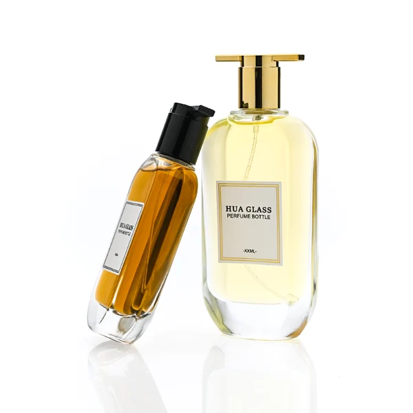 HUA0372 perfume bottle, oval oblong clear glass body with centered paper label, unique architectural T-shaped plastic cap with flat horizontal bar top in shiny silver or glossy black, contemporary minimalist luxury fragrance packaging design available in 50ml and 100ml
