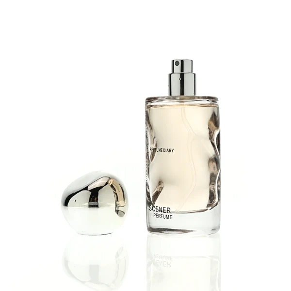 HUA0389 perfume bottle, wavy contoured cylindrical translucent colored glass body with centered gold brand logo and text, sleek spherical dome plastic cap in shiny silver chrome, avant-garde luxury fragrance packaging design in 50ml