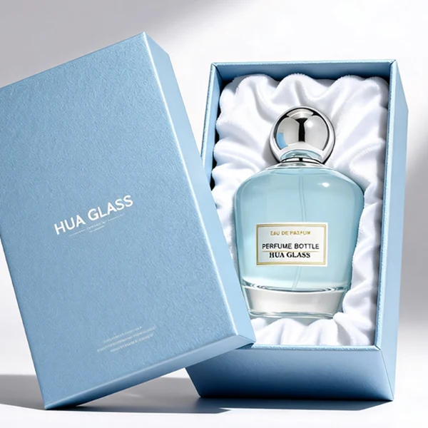 HUA0390 perfume bottle, rounded tapered clear glass body with heavy bottom and centered paper label, sleek spherical dome plastic cap in shiny gold or silver chrome finish, modern luxury fragrance packaging design in 100ml