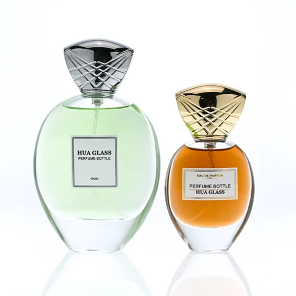 HUA0399 Perfume Bottle – Oval Clear Glass with Heavy Bottom and Textured Engraved Zinc Alloy Cap, Royal Luxury Design (1)