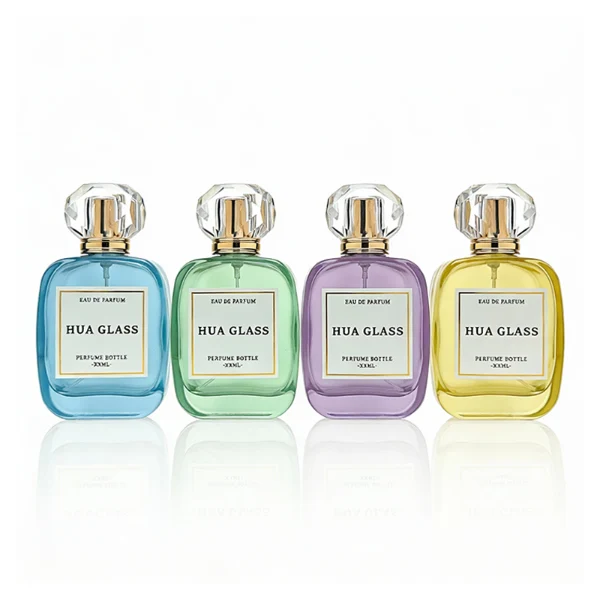HUA0402 perfume bottle, flat squircle rounded square glass body with translucent coating in blue, green, purple or yellow and centered paper label, multi-faceted crystal-clear transparent spherical plastic ball cap with an engraved decorative shiny gold neck, romantic luxury fragrance packaging design available in 30ml, 50ml, and 100ml