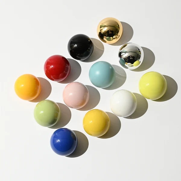 HUA0403 perfume bottle, compact cubic square glass body with translucent coating in blue, pink, black, green or brown and centered printed black brand logo, sleek spherical dome plastic cap in shiny gold finish, modern luxury fragrance packaging design in 15ml