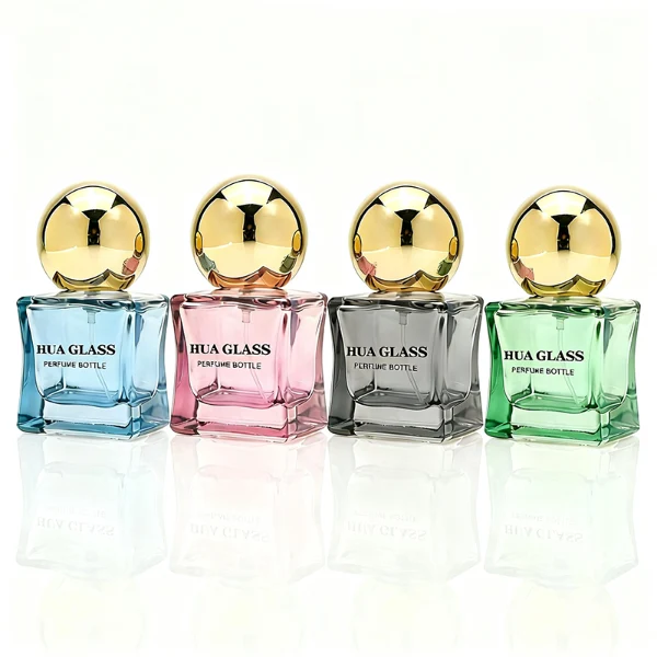 HUA0403 perfume bottle, compact cubic square glass body with translucent coating in blue, pink, black, green or brown and centered printed black brand logo, sleek spherical dome plastic cap in shiny gold finish, modern luxury fragrance packaging design in 15ml