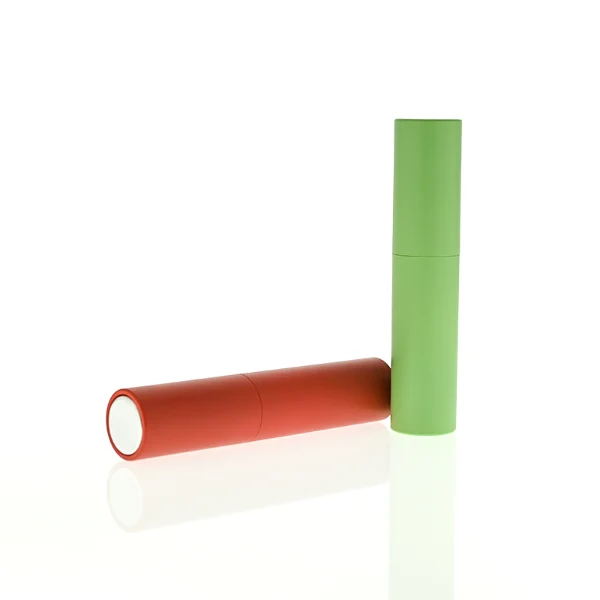 In the file HUA0404 Perfume Bottle – Slim Cylindrical Travel Atomizer with Multi-Color Matte Plastic Sleeve and Internal Glass Vial, four slim cylindrical travel atomizers are arranged inside a black gift box. The atomizers feature matte finishes in red, light green, glossy black, and white, each branded with a golden "HUA GLASS" logo.