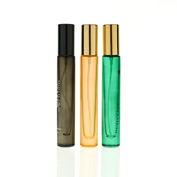 HUA0407 perfume bottle, slim cylindrical glass travel atomizer with tinted semi-transparent multi-color glass body in smoky black, orange or green featuring a subtle brand logo, topped with a luxury gold or black cylindrical zamak cap, modern minimalist travel fragrance packaging available in 10ml