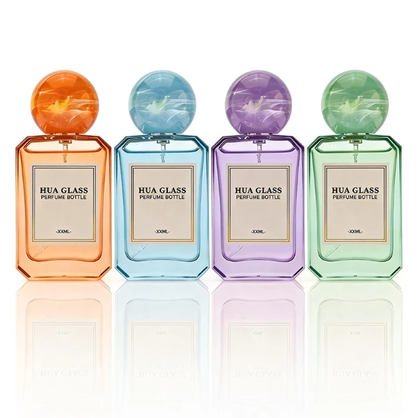 HUA0409 perfume bottle, luxury square glass bottle with beveled edges and transparent multi-color finish in orange, blue, purple, or green, featuring a rectangular paper label and a hollow round ball plastic cap with a marble pattern covering the internal sprayer, modern elegant fragrance packaging design available in 30ml, 50ml, and 100ml