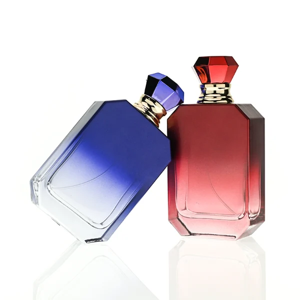 HUA0410 perfume bottle, luxury beveled corner square glass bottle with vibrant gradient or solid finish in black, yellow, pink, or red, featuring a printed gold logo, a silver-colored collar, and a faceted diamond-cut geometric plastic cap, modern elegant fragrance packaging design available in 30ml, 50ml, and 100ml