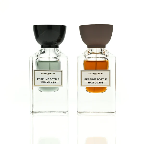 HUA0417 perfume bottle, luxury square glass bottle with a heavy base and high-transparency finish showing colored liquid, featuring a gold-bordered square paper label and a unique tapered cup-shaped plastic cap in glossy black or matte brown, modern elegant fragrance packaging design available in 30ml and 50ml