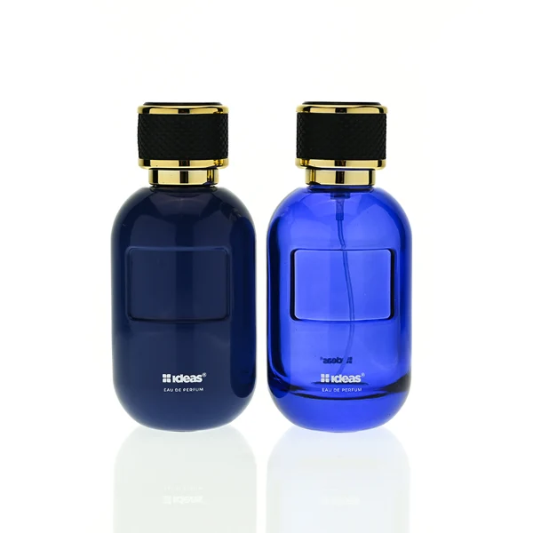 HUA0420 perfume bottle, luxury 100ml rounded oval glass bottle with translucent deep multi-color finish in red, grey, green, or brown, featuring a gold-colored aluminum label and a black textured leather-wrapped plastic cap with gold-colored trim, modern elegant fragrance packaging design