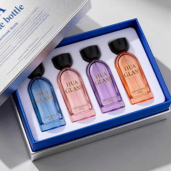 HUA0423 perfume bottle, luxury arch-shaped flat oval glass bottle with translucent finish in green or blue, featuring a dark-colored neck collar and a unique flat-topped glossy black wooden cap, modern elegant fragrance packaging design available in 30ml, 50ml, and 100ml