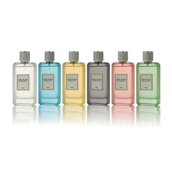 HUA0431 perfume bottle, luxury heavy-base flat rectangular glass bottle with high-transparency finish showing colored liquid, featuring a bordered square paper label and a minimalist white cylindrical plastic cap with gold-colored trim, modern elegant fragrance packaging design available in 30ml, 50ml, and 100ml