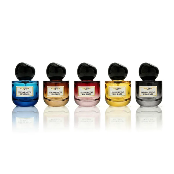 HUA0433 perfume bottle, luxury heavy-base round cylindrical glass bottle with translucent deep multi-color finish, featuring a bordered square paper label and a unique irregular pebble-shaped plastic cap in a glossy black finish, modern artistic fragrance packaging design available in 50ml and 100ml