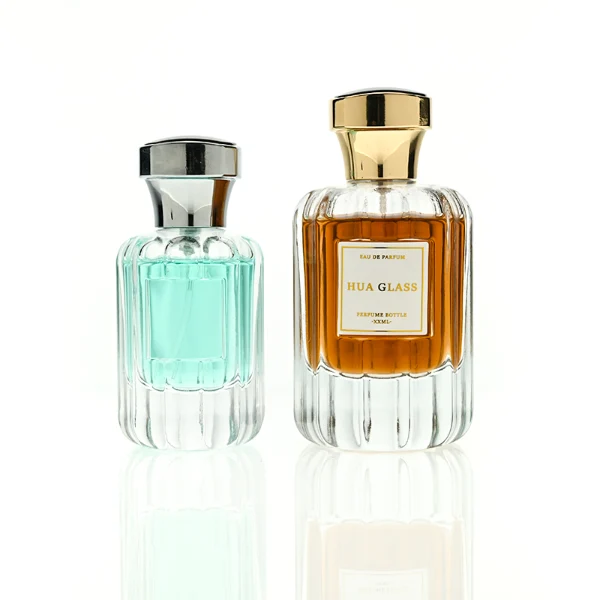 HUA0436 perfume bottle, luxury heavy-base round cylindrical glass bottle with vertical fluted sculpted patterns and high-transparency clear finish, featuring a bordered square paper label and a flared hourglass solid Zamak cap with a mirror-shine glossy finish, modern elegant fragrance packaging design available in 30ml, 50ml, and 100ml