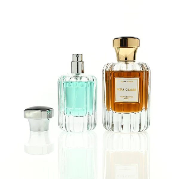 HUA0436 perfume bottle, luxury heavy-base round cylindrical glass bottle with vertical fluted sculpted patterns and high-transparency clear finish, featuring a bordered square paper label and a flared hourglass solid Zamak cap with a mirror-shine glossy finish, modern elegant fragrance packaging design available in 30ml, 50ml, and 100ml