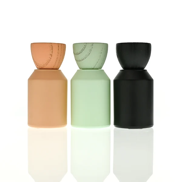 HUA0440 perfume bottle, luxury heavy-base matte finish cylindrical glass bottle with sloped shoulders, featuring a unique egg-shaped natural textured wooden cap showcasing visible organic wood grains in matching colorways, minimalist elegant fragrance packaging design available in 30ml, 50ml, and 100ml