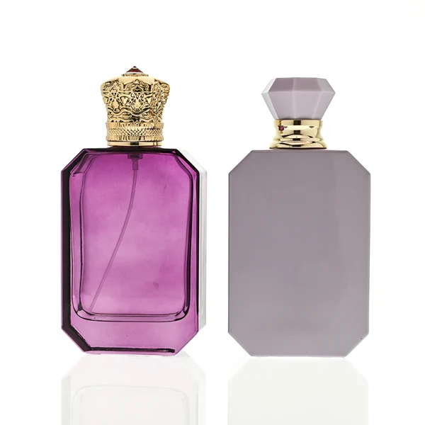 HUA0443 perfume bottle showcases a square angular glass body in vibrant frosted, solid, and gradient color options. It is crowned with artistic plastic caps featuring crown, cube, and diamond-cut shapes. Designed for wholesalers, it provides 30ml, 50ml, and 100ml choices, combining aesthetic variety with durable design for diverse fragrance lines.