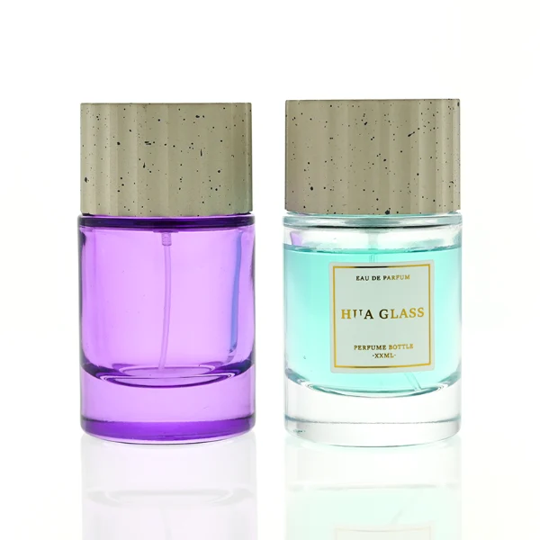 HUA0445 perfume bottle features a thick-bottomed cylindrical glass body paired with a modern textured cylindrical plastic cap. Designed for wholesalers, it offers 30ml, 50ml, and 100ml capacity options, combining an elegant round design with practical durability for diverse fragrance lines.