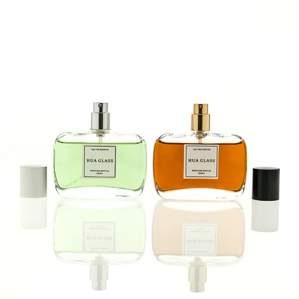 HUA0446 perfume bottle features a clear rounded and short rectangular glass body paired with a sleek cylindrical black or white plastic cap. Designed for wholesalers, it offers a 50ml capacity option, combining a modern minimalist style with durable functionality for diverse cosmetic fragrance lines.
