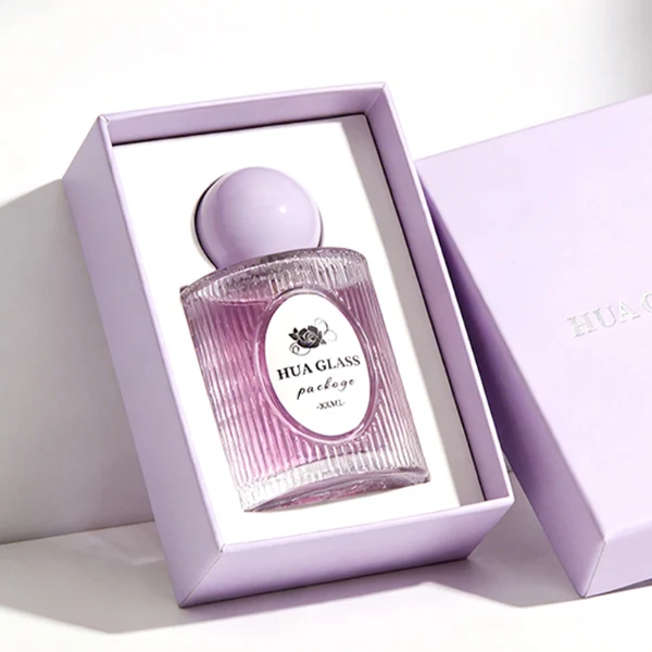 HUA0450 perfume bottle features a clear cylindrical glass body with vertical ribbed grooves, paired with a smooth spherical ball-shaped plastic cap in purple, pink, or yellow. Designed for wholesalers, it offers a 50ml capacity option, combining an elegant textured profile with structural durability for distinct fragrance lines.