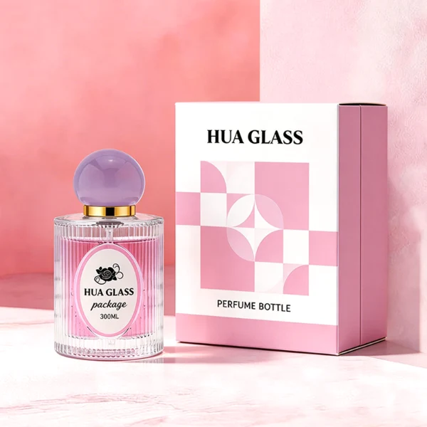 HUA0450 perfume bottle features a clear cylindrical glass body with vertical ribbed grooves, paired with a smooth spherical ball-shaped plastic cap in purple, pink, or yellow. Designed for wholesalers, it offers a 50ml capacity option, combining an elegant textured profile with structural durability for distinct fragrance lines.