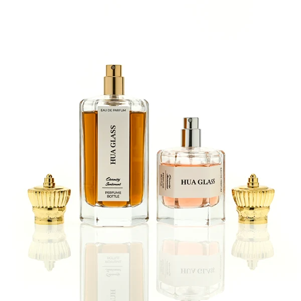 HUA0451 perfume bottle features a clear hexagonal glass body paired with an ornate crown-shaped plastic cap in gold or silver. Designed for wholesalers, it offers 50ml and 100ml choices, combining a regal aesthetic with structural durability for diverse fragrance lines.