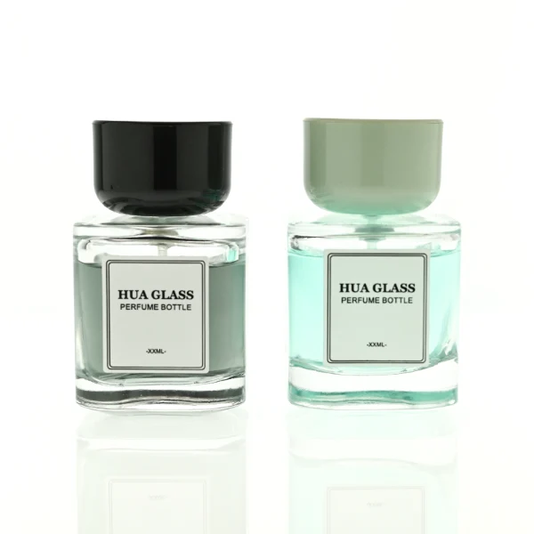 HUA0452 perfume bottle features a clear rounded square glass body paired with a smooth, thick cylindrical plastic cap. Designed for wholesalers, it offers 30ml, 50ml, and 100ml capacity options, combining an elegant minimalist design with functional durability.