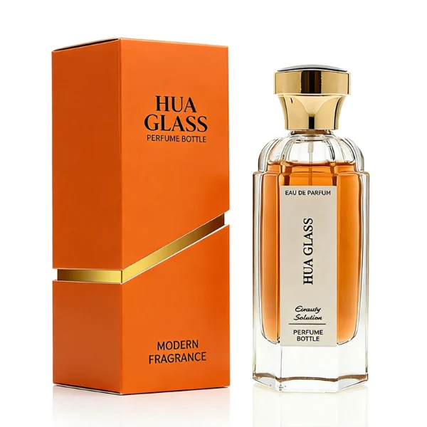 two tall clear hexagonal glass perfume bottles hold teal and amber liquids. The left bottle has a glossy silver cap, while the right bottle is topped with a polished gold cap.
