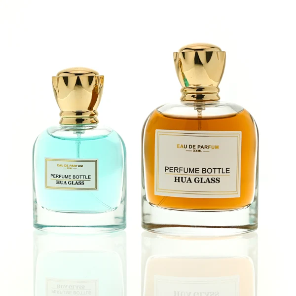 HUA0456 perfume bottle features a rounded, curved clear glass body paired with a unique crown-like glossy golden plastic cap. Designed for wholesalers, it offers 50ml and 100ml capacity options, combining an elegant silhouette with practical durability.
