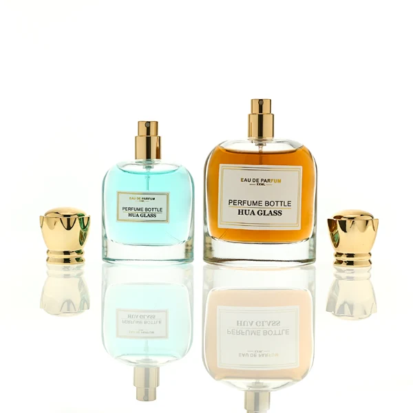 HUA0456 perfume bottle features a rounded, curved clear glass body paired with a unique crown-like glossy golden plastic cap. Designed for wholesalers, it offers 50ml and 100ml capacity options, combining an elegant silhouette with practical durability.