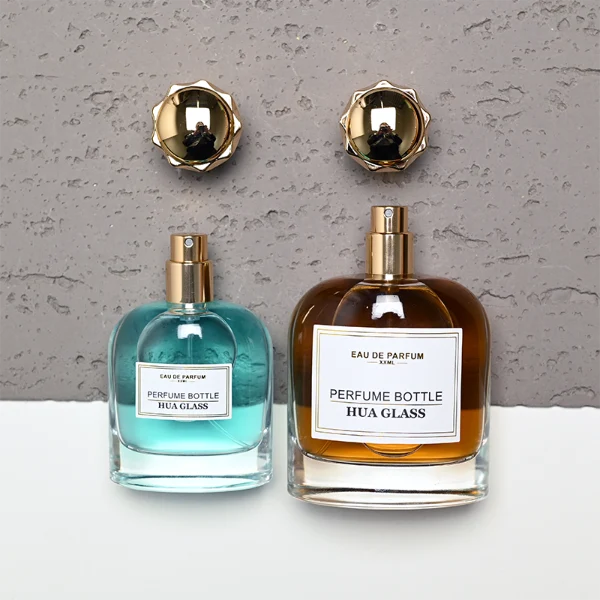 HUA0456 perfume bottle features a rounded, curved clear glass body paired with a unique crown-like glossy golden plastic cap. Designed for wholesalers, it offers 50ml and 100ml capacity options, combining an elegant silhouette with practical durability.