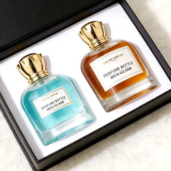 HUA0456 perfume bottle features a rounded, curved clear glass body paired with a unique crown-like glossy golden plastic cap. Designed for wholesalers, it offers 50ml and 100ml capacity options, combining an elegant silhouette with practical durability.