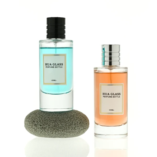 HUA0458 perfume bottle features a clear, thick-bottomed cylindrical glass body paired with a ribbed cylindrical plastic cap in black, brown, or silver. it offers 80ml and 85ml capacity choices, combining a classic round profile with reliable durability for wholesale fragrance markets.