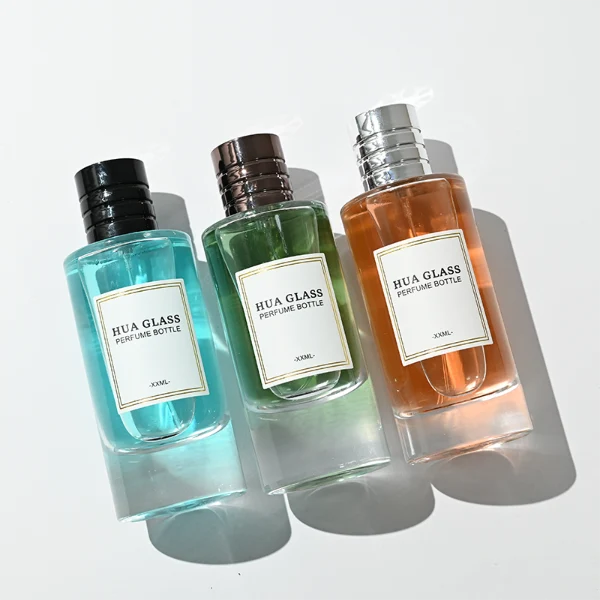 HUA0458 perfume bottle features a clear, thick-bottomed cylindrical glass body paired with a ribbed cylindrical plastic cap in black, brown, or silver. it offers 80ml and 85ml capacity choices, combining a classic round profile with reliable durability for wholesale fragrance markets.
