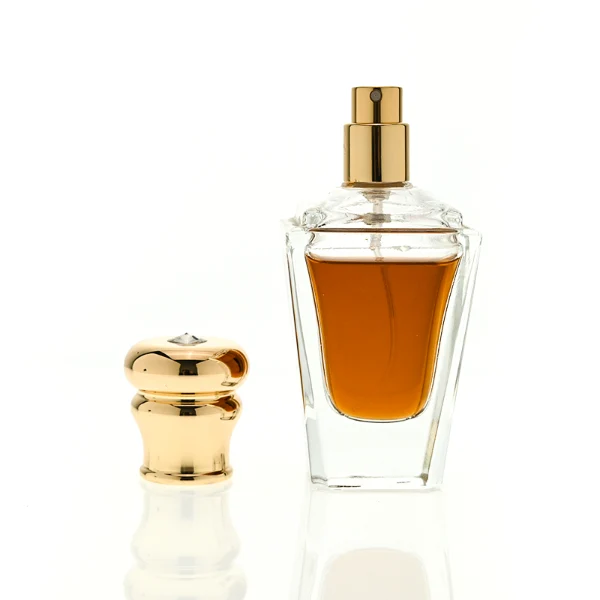 HUA0459 perfume bottle, features an architectural, angular clear glass body with a tapered silhouette, paired with a heavy metallic crown-shaped Zamac cap. Designed for luxury wholesalers, it offers a 50ml capacity option blending upscale geometric lines with premium durability.