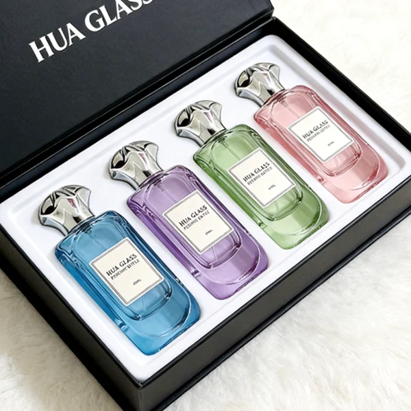 A luxury rectangular perfume bottle featuring a thick, rounded clear glass base and a heavy metallic crown-shaped Zamac cap in gold, silver, or black.