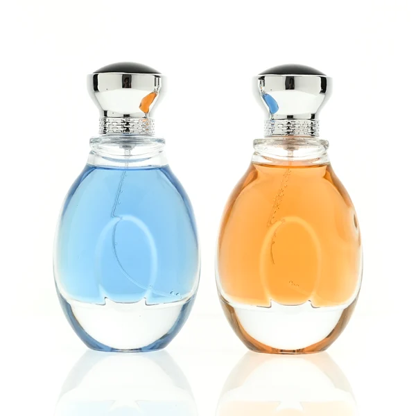 A 100ml clear glass perfume bottle with a smooth, globular curved profile and a thick base. The neck features a detailed metallic collar paired with a silver crown-motif cap topped with a dark glossy insert.
