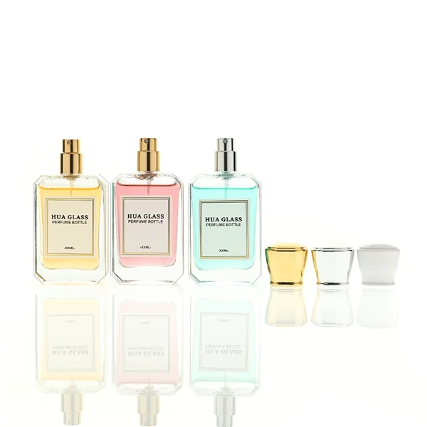A diamond-cut rectangular glass perfume bottle with a clear, angular profile and an elegant faceted border, paired with a smooth, trapezoidal square plastic cap available in gold, silver, or matte white.