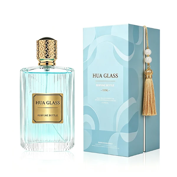 A rectangular clear glass perfume bottle detailed with distinct vertical grooves and a smooth central label indentation, paired with a cylindrical golden plastic cap featuring an intricate textured pattern.