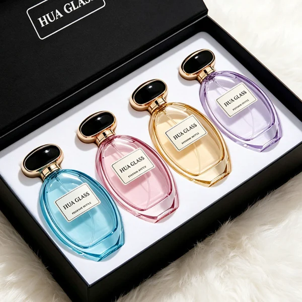 a globular curved clear glass perfume bottle features an oval silhouette with a heavy base, paired with a smooth, pebble-shaped plastic cap available in glossy solid black with a ribbed gold collar, or a flat-oval black design encased in a gold border.