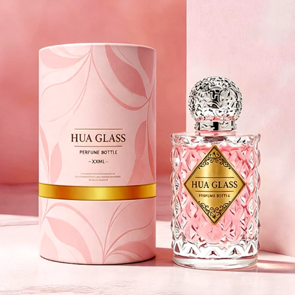 two clear textured glass perfume bottles hold light green and pink liquids. The bottles are topped with round, ornate filigree caps finished in polished gold on the left and bright silver on the right.