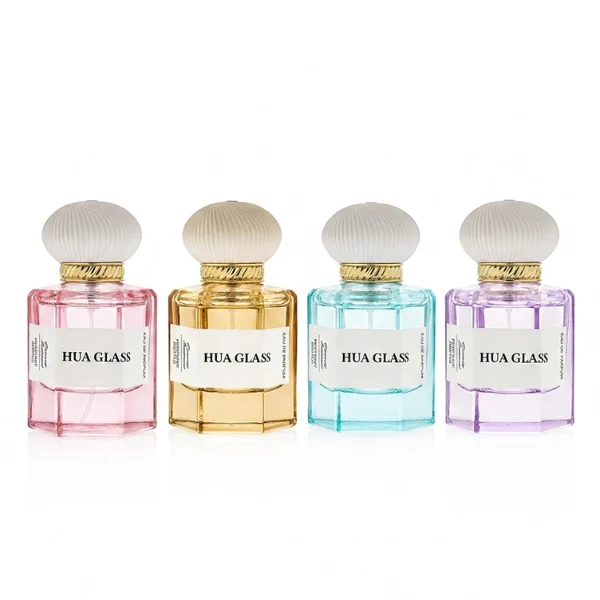 a hexagonal perfume bottle crafted from semi-translucent purple glass features a structured angular silhouette, paired with a pebble cobblestone-shaped plastic cap. The cap is available as either a smooth glossy black or a textured, vertically-ribbed matte white dome, both sitting atop an elegant, braided metallic gold collar.