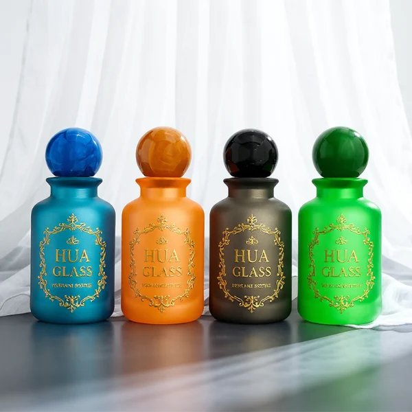 A lineup of four cylindrical frosted glass perfume bottles in matte shades of blue, orange, dark grey, and green. Each bottle is paired with a matching large spherical ball cap featuring a glossy, marbled stone texture in deep blue, amber brown, black, and forest green.