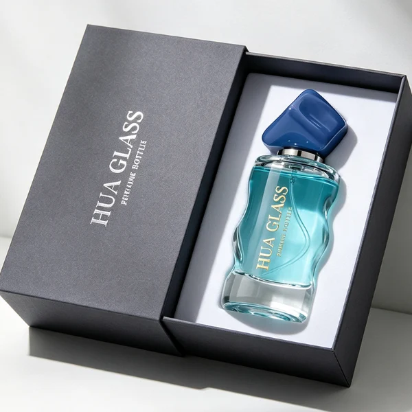 A lineup of four clear glass perfume bottles featuring unique, wave-curved organic sides and heavy transparent bases. The bottles are filled with yellow, pink, light blue, and amber liquids, each topped with an asymmetrical, abstract artistic cap resembling a tumbled stone or distorted cube in glossy mustard yellow, light grey, periwinkle blue, and solid black finishes.