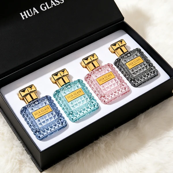 Two square semi-translucent violet glass perfume bottles are shown in 50ml and 100ml sizes, featuring an all-over rockstud-inspired studded diamond texture surrounding a smooth rectangular center panel. Each bottle is topped with a heavy, premium polished golden Zamac square geometric cap with a short cylindrical collar.