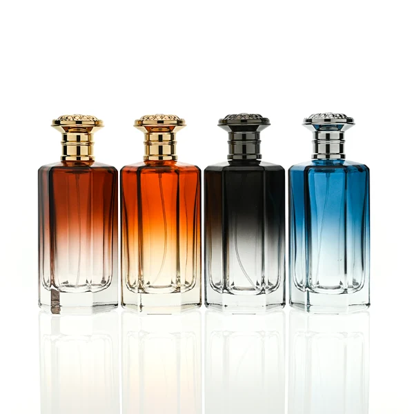 HUA0439 perfume bottle, luxury heavy-base polyhedral angular glass bottle with translucent deep multi-color gradient finish, featuring a crown-shaped flared hourglass solid Zamak cap with an intricately sculpted silver-colored glossy metallic finish, modern elegant fragrance packaging design available in 50ml and 100ml