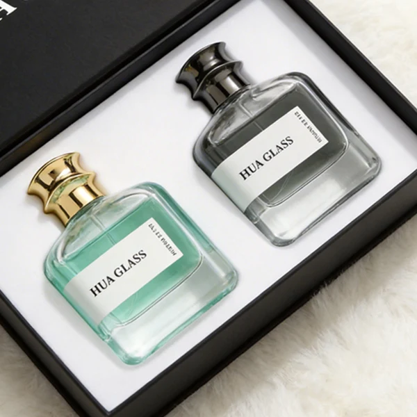 HUA0437 perfume bottle, luxury 100ml heavy-base flat rectangular glass bottle with high-transparency clear finish, featuring a wraparound rectangular paper label and a unique irregular bamboo-joint solid Zamak cap with a mirror-shine glossy metallic finish, modern elegant fragrance packaging design